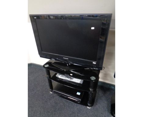 A Panasonic Viera 32" LCD TV on stand with remote, together with a Panasonic DVD recorder. 