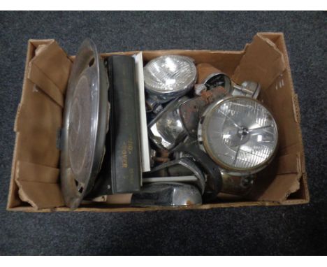 A box of vintage car lights, Land Rover workshop manual, speedometers, Mercedes hub cap etc. 