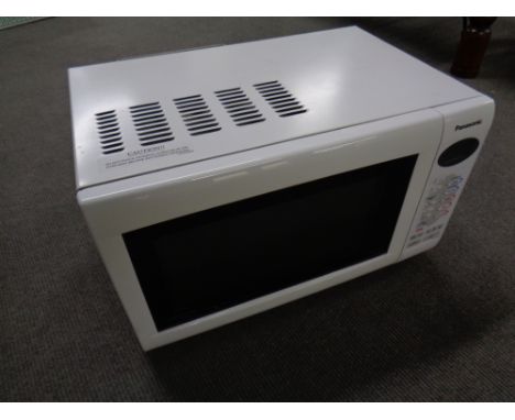 A Panasonic Inverter microwave together with a ceramic knife set, boxed. 
