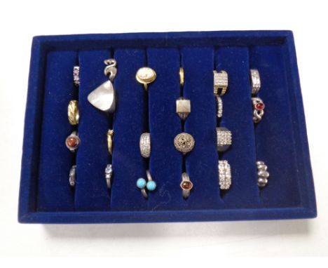 A ring tray containing a quantity of assorted silver and dress rings 