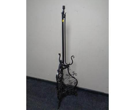A wrought metal standard lamp. 