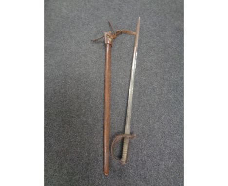 A British 1896 pattern heavy cavalry sword by Sandilands &amp; Son of London, in leather scabbard. 