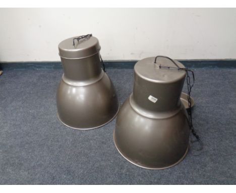 A pair of industrial style light fittings. 