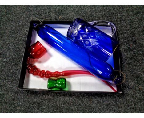 A box of four pieces of antique and later coloured glass ware to include Bohemian tankard, blue glass rolling pin, pipe. 