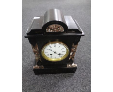 A 19th century black slate and marble mantel clock with enamelled dial. 