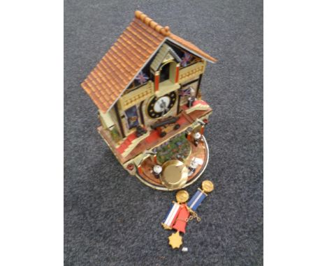 A Bradford Editions The Faithful Fuzzies Mighty Marines novelty cuckoo clock with pendulum and weights 