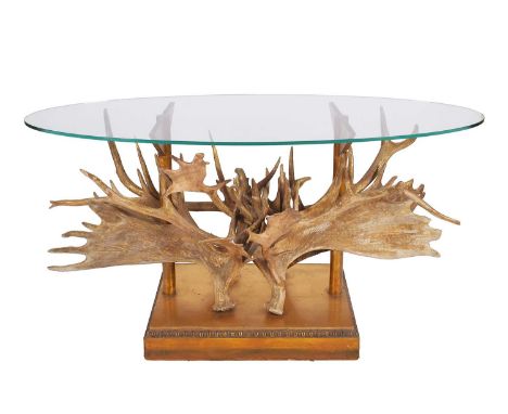 Animal Furniture: A Moose Antler Mounted Glass Topped Console Table, modern, the oval plate glass top, above various sized en