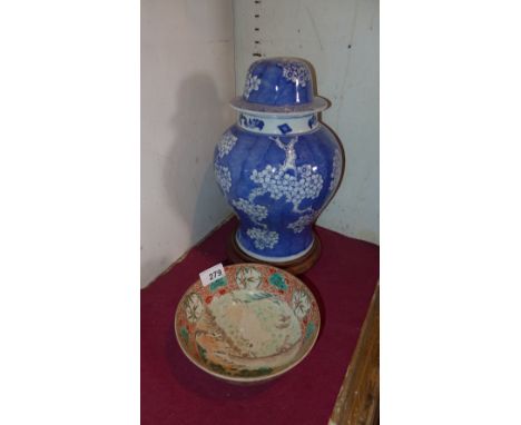 A Japanese porcelain bowl, hand painted with a landscape scene to the interior and flowers to the exterior, together with a C