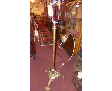 An Art Nouveau brass standard lamp 