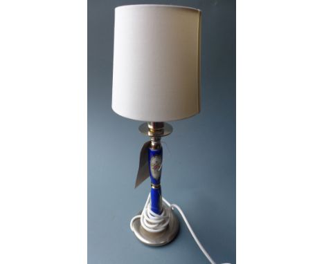 An Italian hand painted porcelain table lamp decorated with flowers on a blue ground