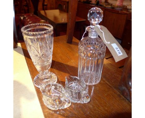 A cylindrical crystal decanter together with a crystal vase, a jug and a sugar bowl 