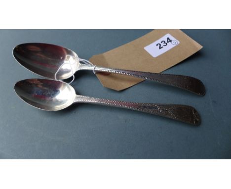 A Hester Bateman hallmarked silver spoon assayed in London, with bright cut engraving, together with a smaller spoon by the s