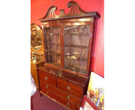 A Georgian mahogany display cabinet fitted pair of astragal glazed panel doors above three long drawers with brass ring handl