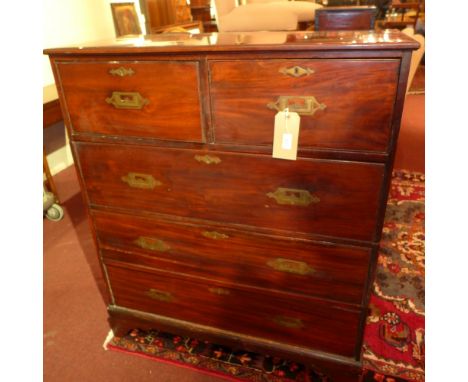 A 19th century mahogany campaign chest in two sections, having two short over three long drawers, raised on bracket supports 