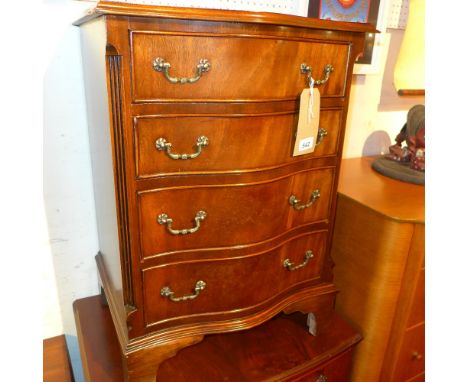 A Georgian style mahogany serpentine fronted chest fitted four drawers with brass handles on bracket feet