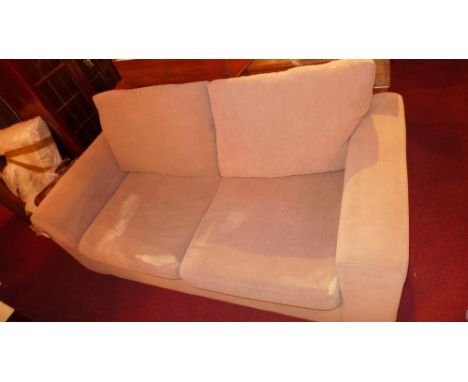 A contemporary designer sofa bed upholstered in beige fabric