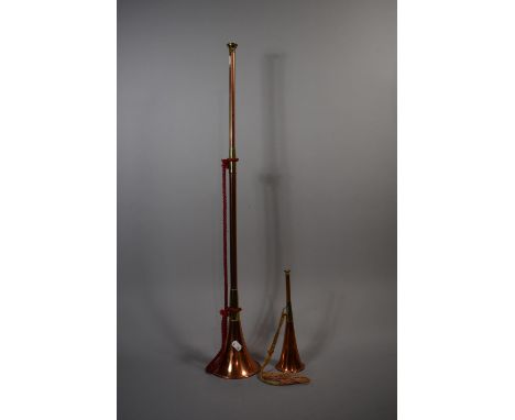 A Small Reproduction Copper and Brass Coaching Horn and a Reproduction Hunting Horn 