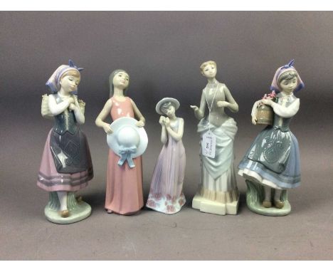 FOUR LLADRO FIGURES OF LADIES,the tallest 27cm high, along with one other figure (5)Condition report: Small losses to flowers
