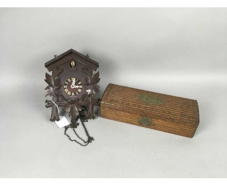 LATE 19TH CENTURY BRASS MOUNTED WOOD GLOVE BOX,27cm wide, along with a 20th Century cuckoo clock of small proportions (2)