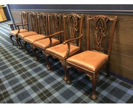 SET OF SIX MAHOGANY DINING CHAIRS OF CHIPPENDALE DESIGN,including two carvers, with pierced splats and drop-in seats on front