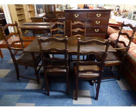 An Oak Refectory Style Dining Table and Six Ladder Back Chairs 