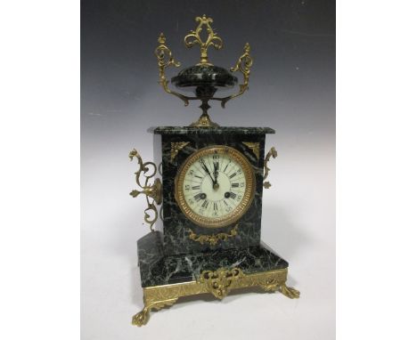 A French variegated green marble and ormolu mantle clock  