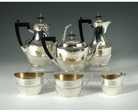 An American six piece metalwares tea and coffee set,by Black, Starr & Frost, New York, comprising:- an oval teapot, the lower