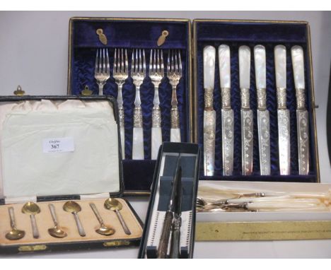 A mother of pearl handled fruit service cake service, silver tea spoons and two knives  