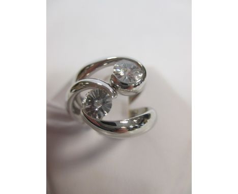 Two fancy cut diamond and platinum rings, the first a round fancy cut diamond, estimated approx. 0.57cts, tension set in a cu