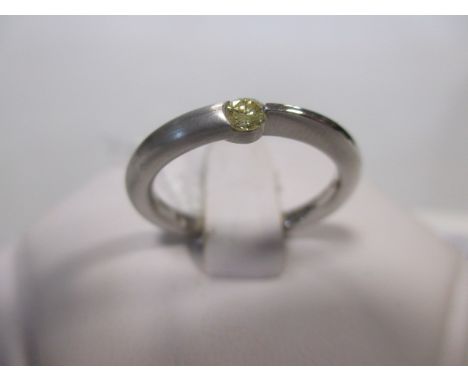 A fancy pale yellow diamond and platinum ring, the round brilliant cut diamond, estimated approx. 0.10cts, in a tension setti