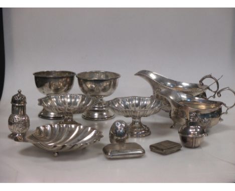 A collection of silver to include two small rose bowls, London 1925, two circular shaped sweetmeat dishes, a shell pattern bu