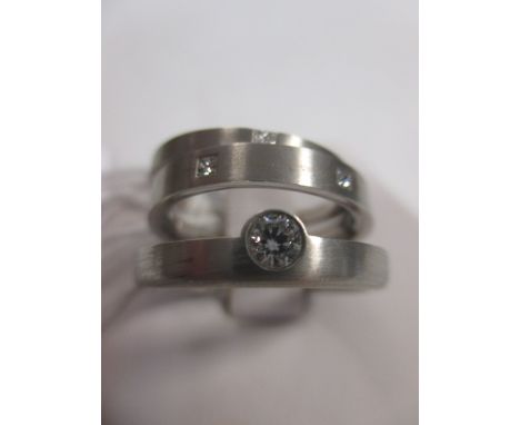 Three diamond and platinum rings, the first a single stone diamond ring, estimated approx. 0.10cts, in a rubover setting of s