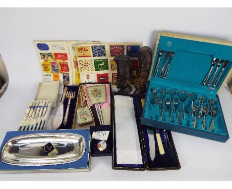 Lot to include plated ware, flatware, boxed Crummles enamel trinket box, tribal carvings and similar.