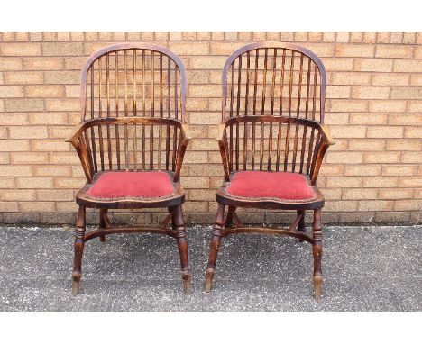 A pair of Windsor stick back armchairs.