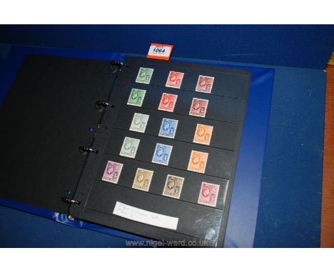A blue Prinz Stamp Album with 38 hanger sheets, British Empire and Commonwealth mix, mainly George VI. Interesting range of m