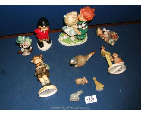 Seven Goebel and other figures including Hunting Pink, Brother and a Goebel model of two children kissing dated 1957, USSR bi