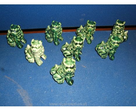 A set of nine Chinese ceramic miniature Temple Dogs.