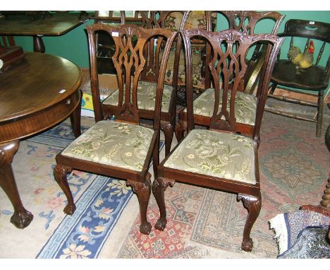 A set of four Georgian style Dining Chairs, having carved top rail, fret-cut pierced and carved splat, drop-in pastel green f