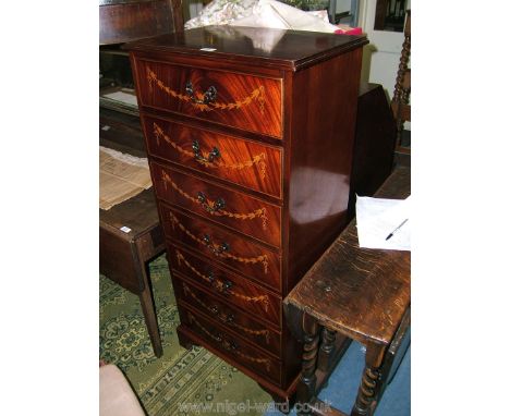 A reproduction Regency style Bedroom flight of seven Drawers, the Oak lined drawers with cock beaded edges, aged brass handle
