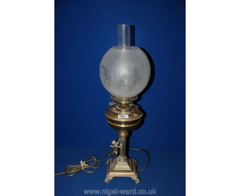A Brass Oil Lamp with glass shade converted to electric
