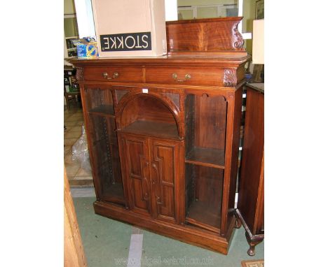 A superb Edwardian Walnut Bookcase/Cupboard by Laventons Ltd., of Bristol having upstand galleried back with moulded top and 