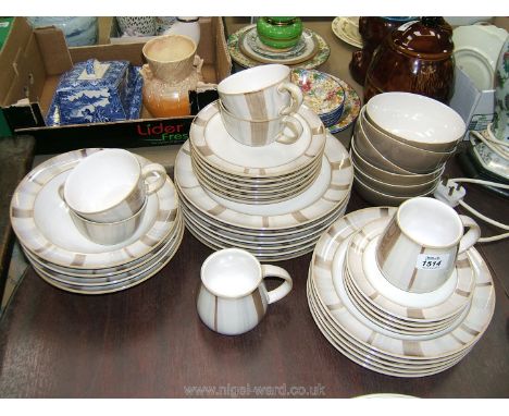 A quantity of brown Denby China to include dinner plates, side plates, tea plates, soup dishes, cereal bowls, cup and saucers