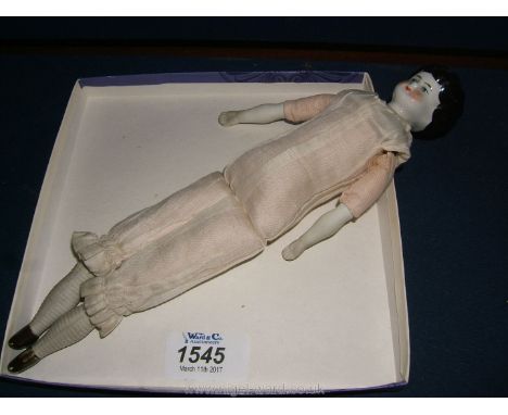 A Victorian Doll with ceramic head/shoulder/arms and legs, body stuffed with sawdust