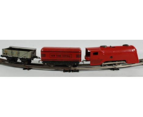A 1930's American Marx tin plate 'O' gauge Clockwork Train Set complete with four red carriages and rolling stock, six sets o