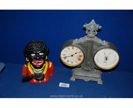 An ethnic Money Box and a metal framed clock/thermometer/ barometer, a/f.