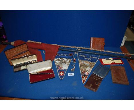 Miscellaneous pens, wallets and  flag on a pole, walking stick, pennants etc.