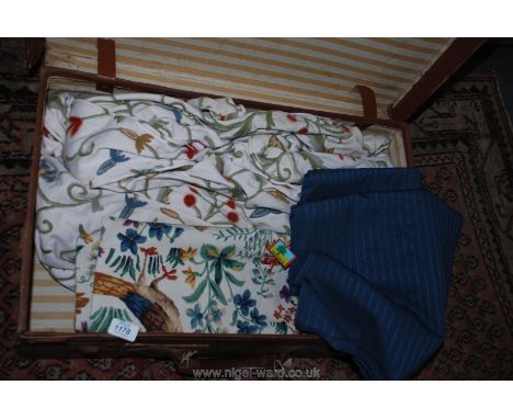 An old case containing miscellaneous Fabric including Suiting, Crewel work cushion covers, etc.