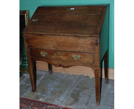 An untouched circa 1760 Oak Country made Bureau having plain top over two plank cleated edge fall opening to reveal paint fin