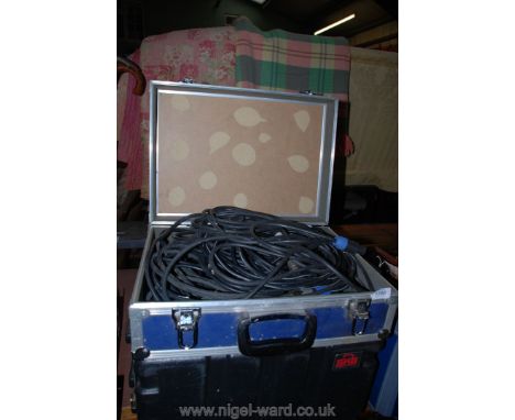 An Aluminium trimmed flight Case of various P.A. leads including pair of speakon speaker leads, speaker to jack/XLR speaker l