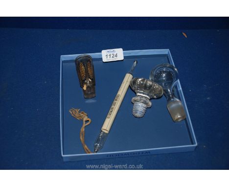 A floating Dairy Thermometer, decorative tot glasses and two glass decanter stoppers
